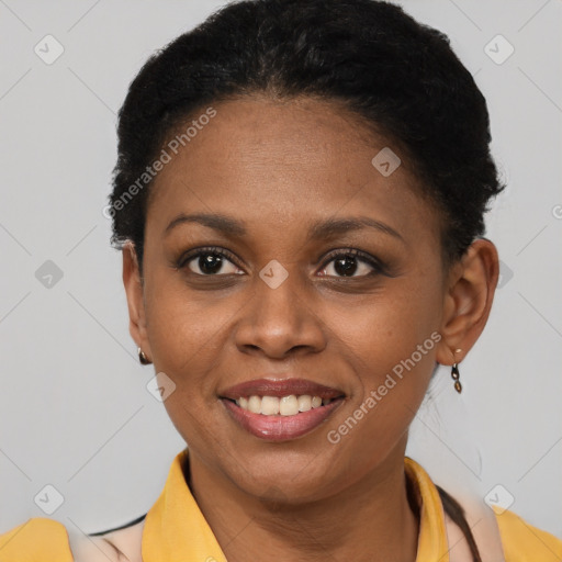 Joyful black young-adult female with short  black hair and brown eyes