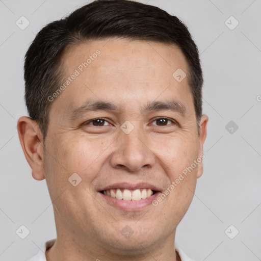 Joyful white adult male with short  brown hair and brown eyes