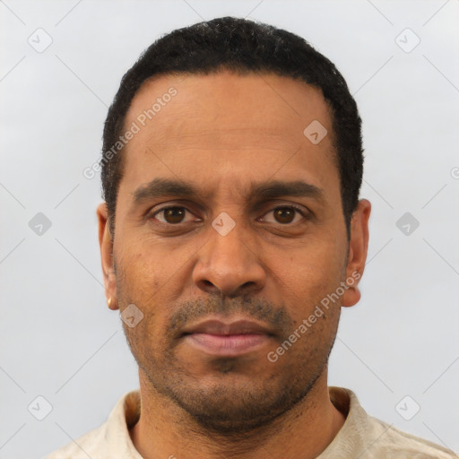Neutral latino adult male with short  black hair and brown eyes