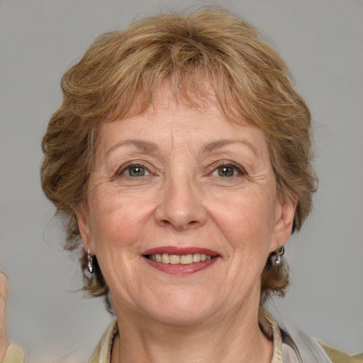 Joyful white middle-aged female with medium  brown hair and brown eyes