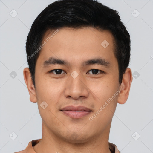 Joyful asian young-adult male with short  brown hair and brown eyes