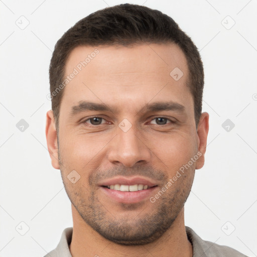 Joyful white young-adult male with short  brown hair and brown eyes