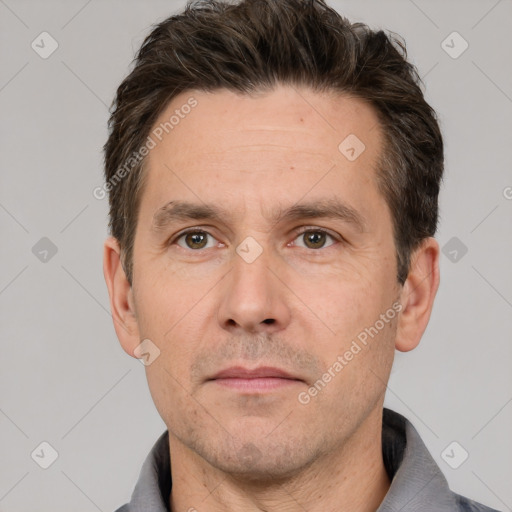 Neutral white adult male with short  brown hair and brown eyes