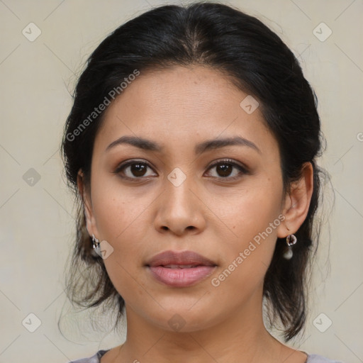 Joyful latino young-adult female with medium  brown hair and brown eyes