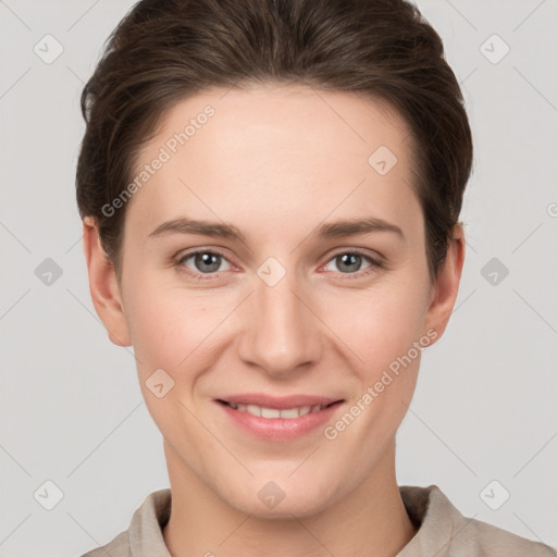 Joyful white young-adult female with short  brown hair and grey eyes