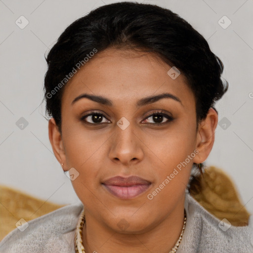 Joyful latino young-adult female with short  brown hair and brown eyes