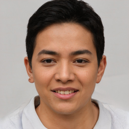 Joyful asian young-adult male with short  brown hair and brown eyes