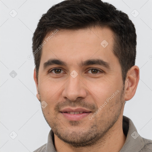 Joyful white young-adult male with short  brown hair and brown eyes