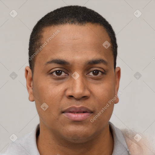 Joyful latino young-adult male with short  brown hair and brown eyes