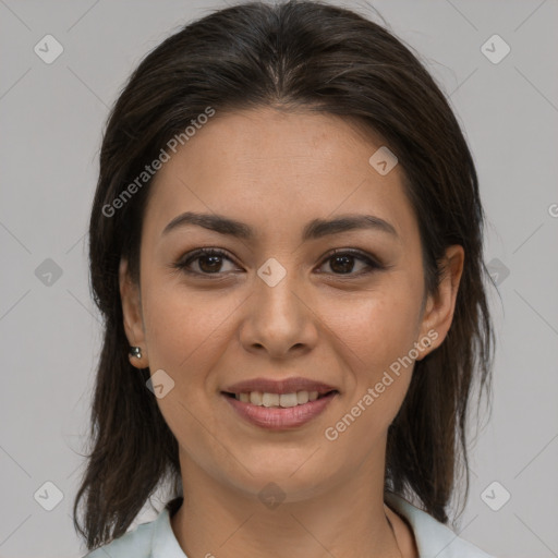 Joyful latino young-adult female with medium  brown hair and brown eyes