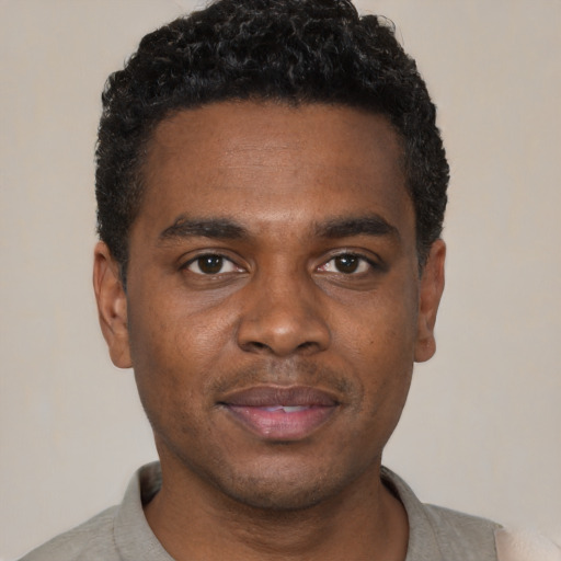 Neutral black young-adult male with short  black hair and brown eyes