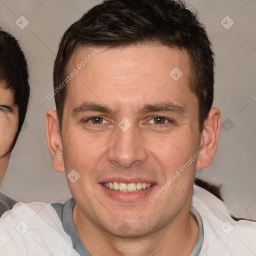 Joyful white adult male with short  brown hair and brown eyes