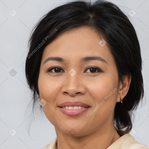 Joyful asian adult female with medium  brown hair and brown eyes