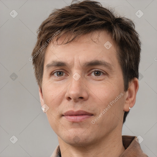 Joyful white adult male with short  brown hair and brown eyes