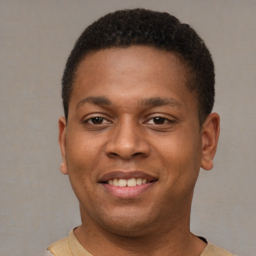 Joyful latino young-adult male with short  brown hair and brown eyes