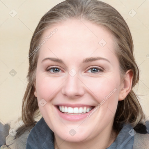 Joyful white young-adult female with medium  brown hair and blue eyes