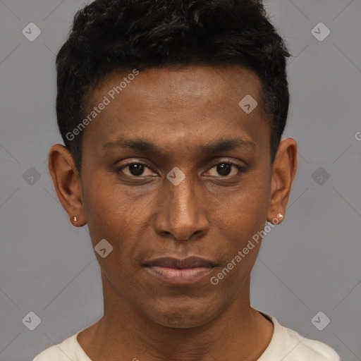 Joyful black young-adult male with short  brown hair and brown eyes