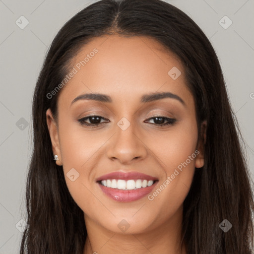 Joyful latino young-adult female with long  brown hair and brown eyes