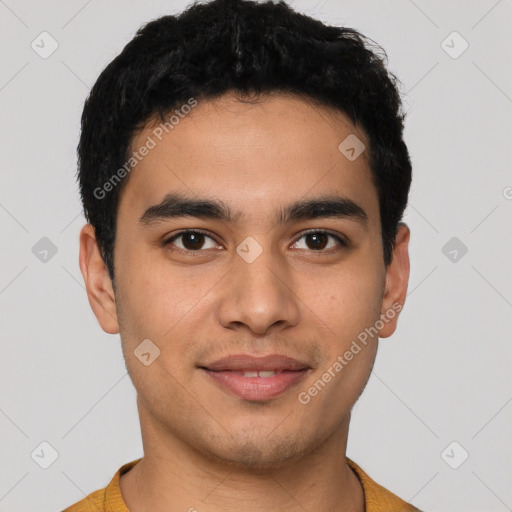 Joyful latino young-adult male with short  black hair and brown eyes