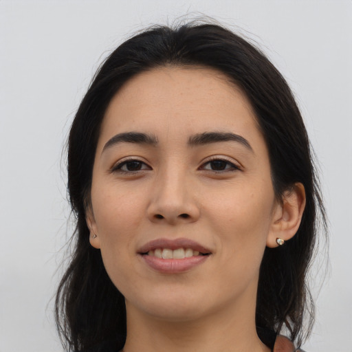 Joyful asian young-adult female with long  brown hair and brown eyes