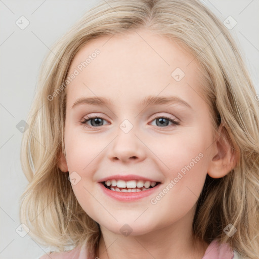 Joyful white child female with medium  brown hair and blue eyes