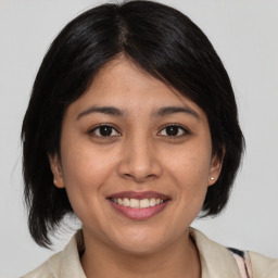 Joyful asian young-adult female with medium  black hair and brown eyes