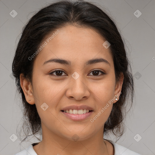 Joyful latino young-adult female with medium  brown hair and brown eyes