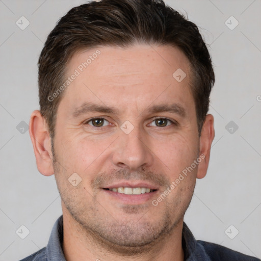 Joyful white adult male with short  brown hair and brown eyes