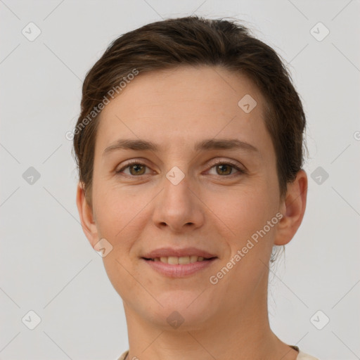 Joyful white young-adult female with short  brown hair and grey eyes