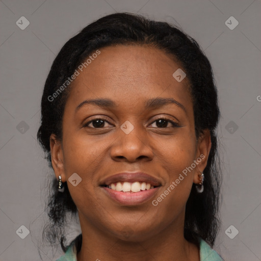 Joyful black young-adult female with medium  black hair and brown eyes