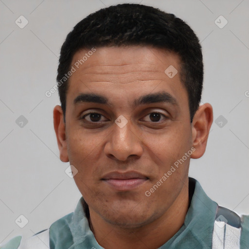 Joyful latino young-adult male with short  black hair and brown eyes