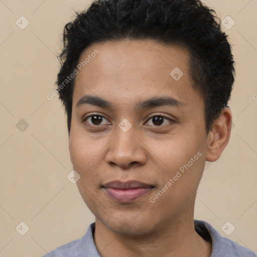 Joyful latino young-adult male with short  brown hair and brown eyes