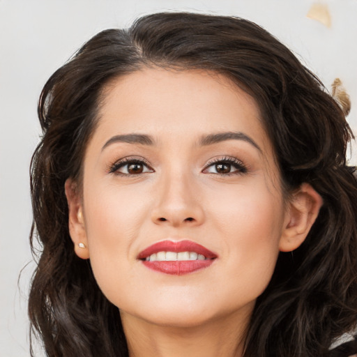 Joyful white young-adult female with long  brown hair and brown eyes