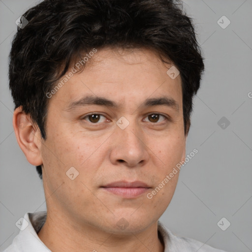 Joyful white adult male with short  brown hair and brown eyes