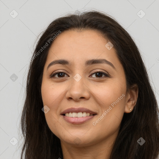 Joyful latino young-adult female with long  brown hair and brown eyes