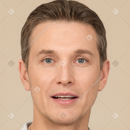 Joyful white adult male with short  brown hair and grey eyes