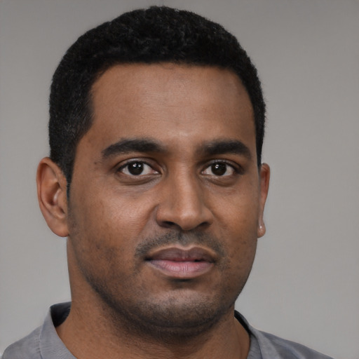 Neutral black young-adult male with short  black hair and brown eyes