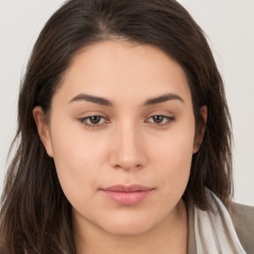 Neutral white young-adult female with long  brown hair and brown eyes