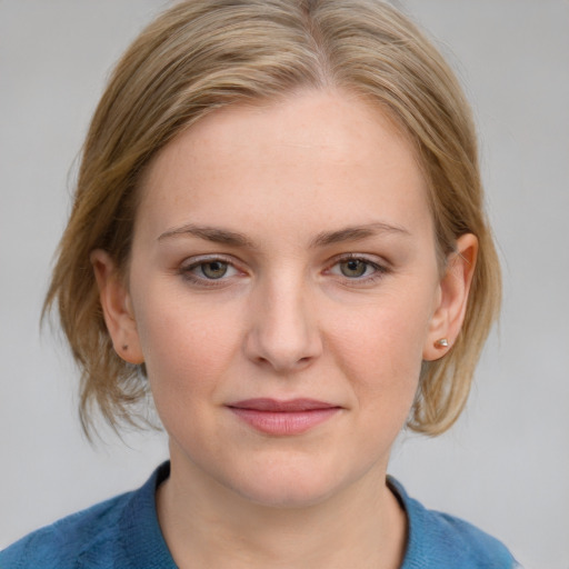 Joyful white young-adult female with medium  brown hair and blue eyes