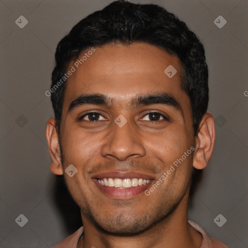 Joyful latino young-adult male with short  black hair and brown eyes