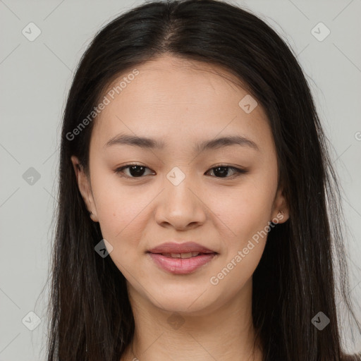 Joyful asian young-adult female with long  brown hair and brown eyes