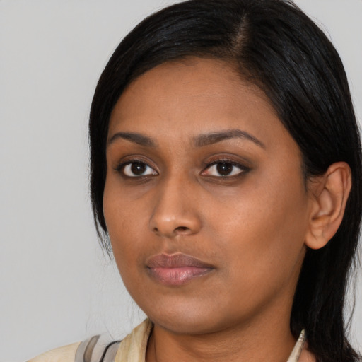 Neutral asian young-adult female with medium  black hair and brown eyes