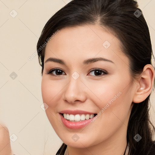 Joyful white young-adult female with long  brown hair and brown eyes