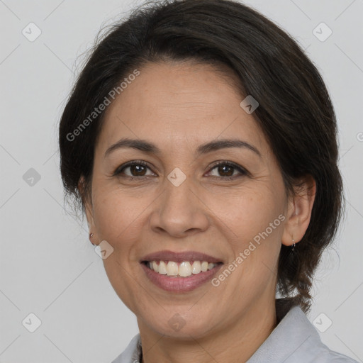 Joyful white adult female with medium  brown hair and brown eyes