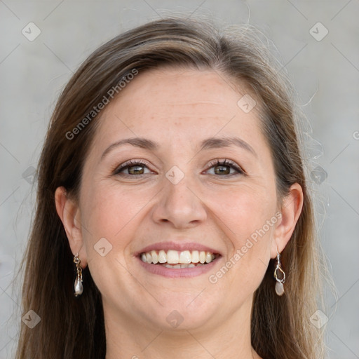 Joyful white adult female with long  brown hair and grey eyes