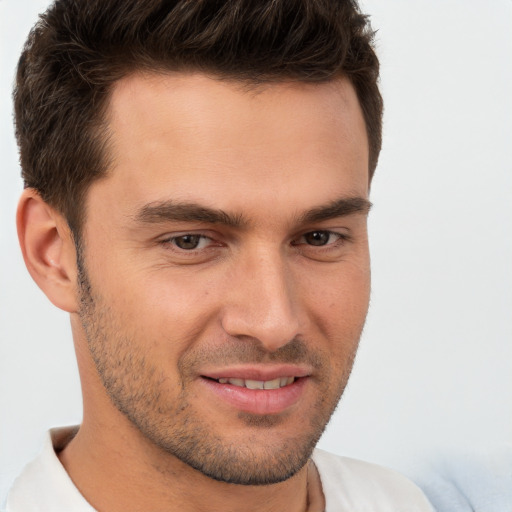 Joyful white young-adult male with short  brown hair and brown eyes