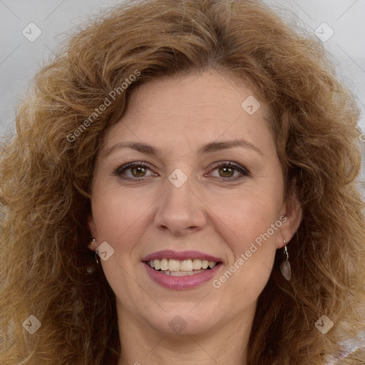 Joyful white adult female with long  brown hair and brown eyes