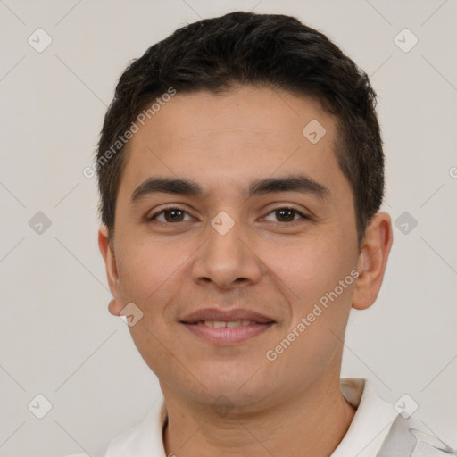 Joyful latino young-adult male with short  brown hair and brown eyes