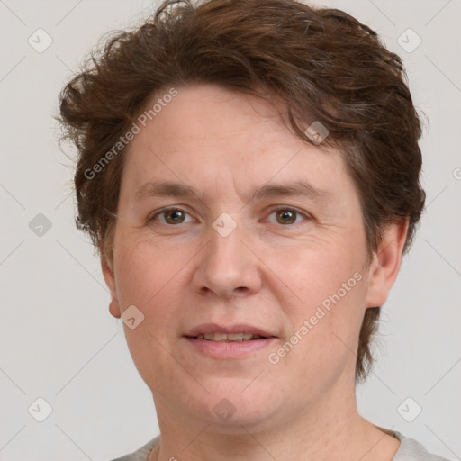 Joyful white adult male with short  brown hair and grey eyes