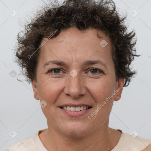 Joyful white adult female with short  brown hair and brown eyes